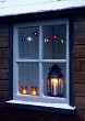 Vintage lantern on window ledge in winter